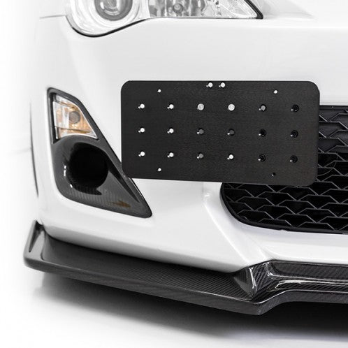For those who live in states that require a front plate: ADF Customs tow  hook receiver kit, coupled with the Raceseng plate relocation kit and tug  shaft. : r/FocusST